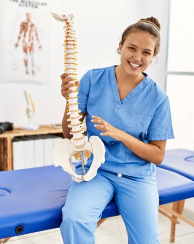 Nexus Medical clinician with a spine model
